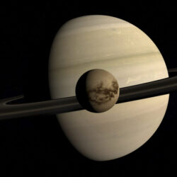 Titan in front of Saturn - Deposit Photos